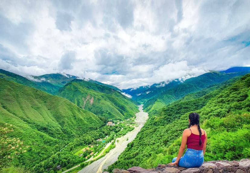 Student enjoying a mountain view in Argentina during a high school exchange program, surrounded by nature and local life.