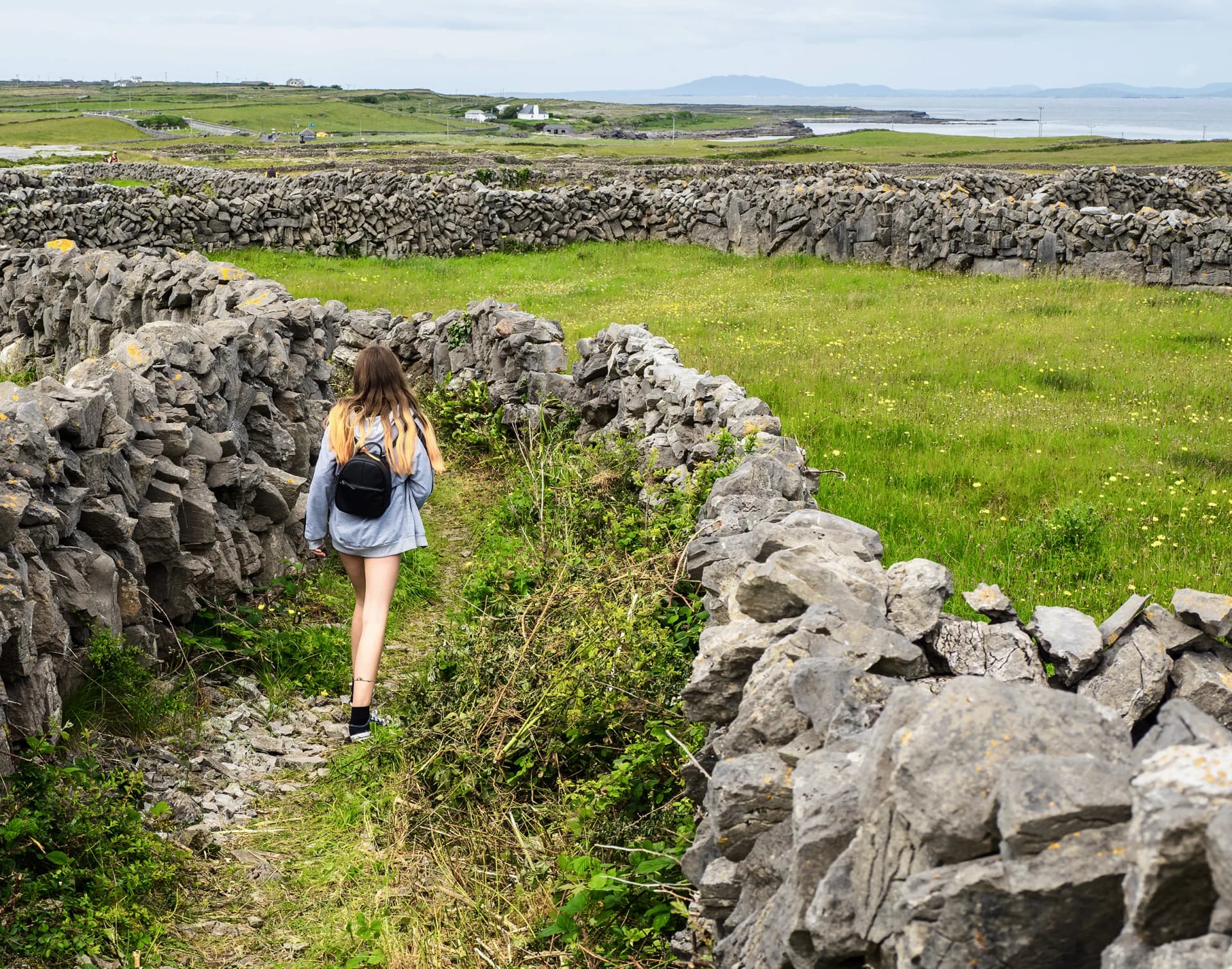 Student walking in the Irish countryside during a school year in Ireland, experiencing nature, personal growth and school life.