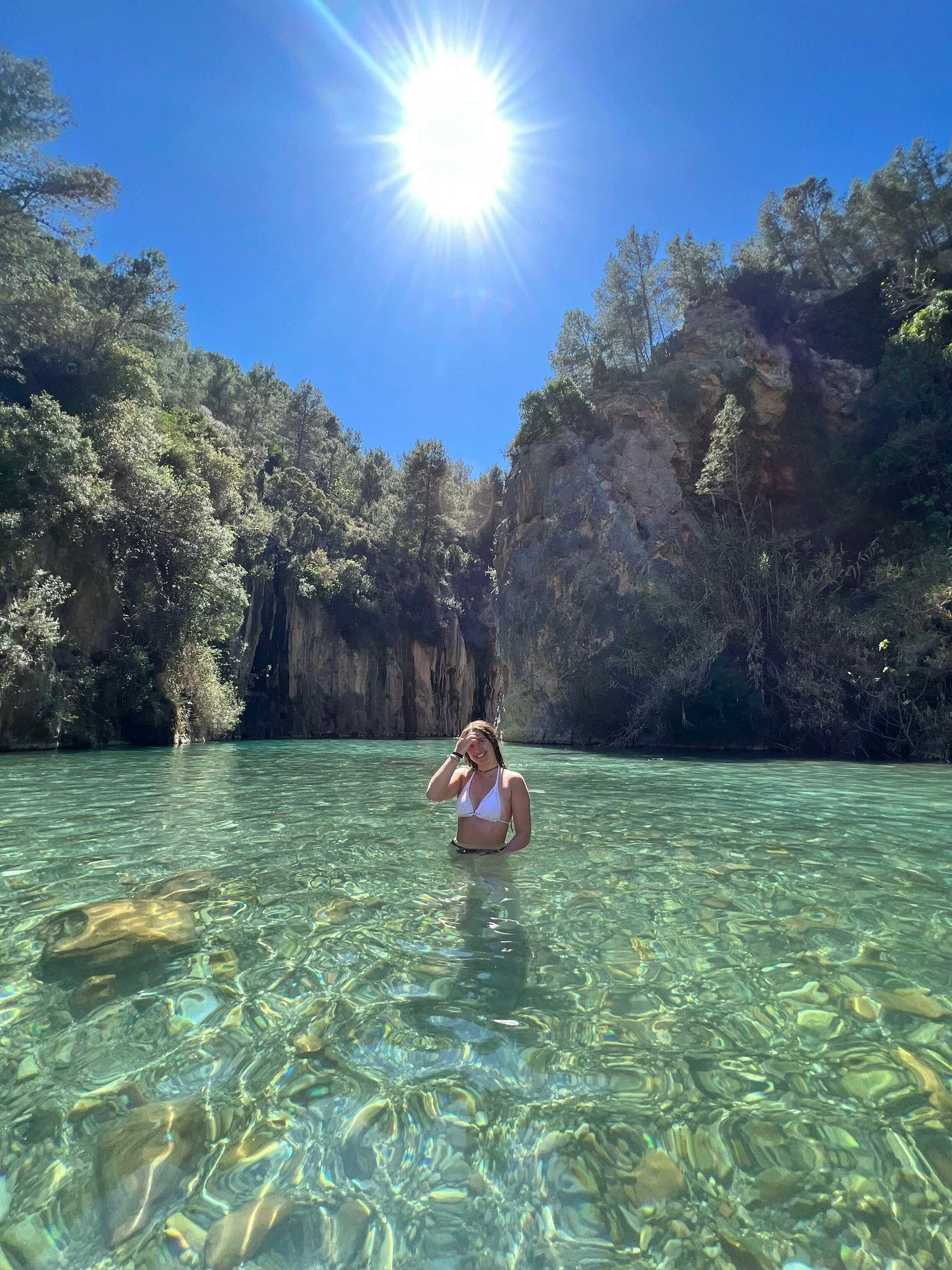 Language stays in Spain with students relaxing in clear water surrounded by nature